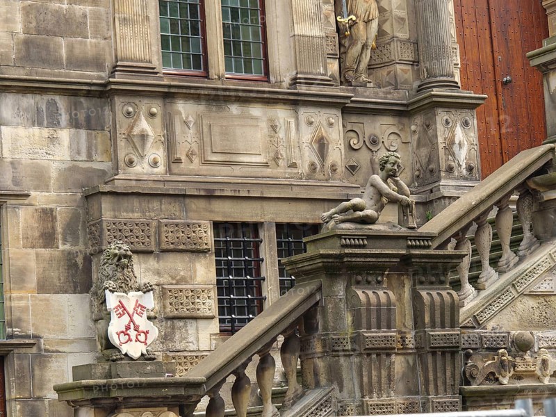 Ornate historic building with statues and coats of arms on an impressive stone staircase, Leiden, Netherlands