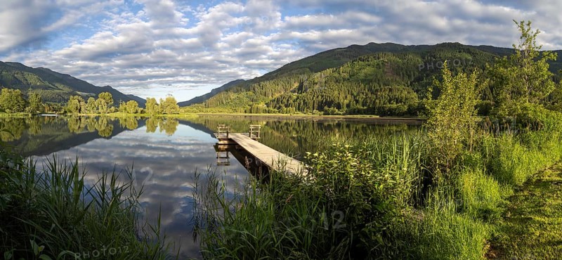 Footbridge leading into a lake, Gaishorner See in the evening light, panoramic view, Gaishorn am See, Paltental, Styria, Austria, Europe