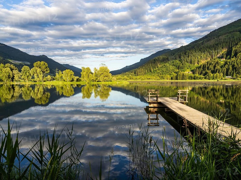 Footbridge leading into a lake, Gaishorner See in the evening light, Gaishorn am See, Paltental, Styria, Austria, Europe