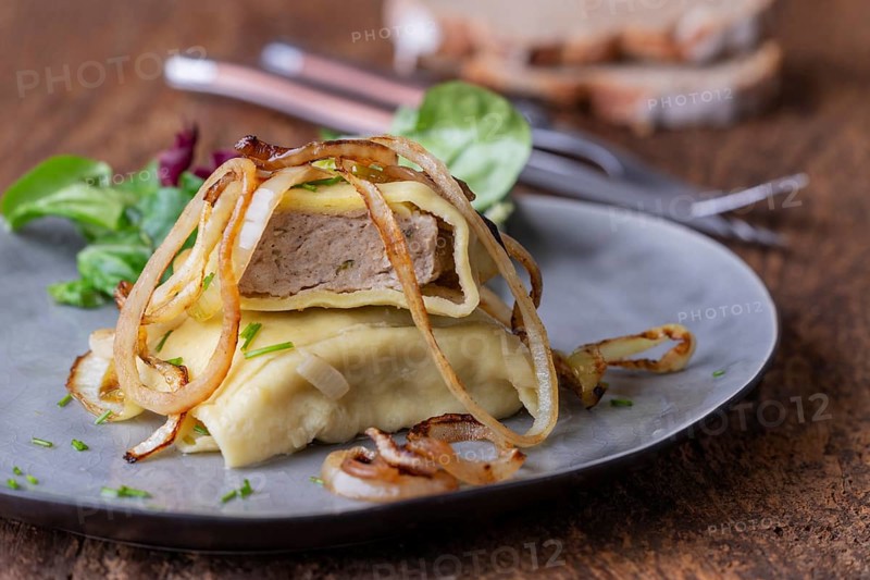 Swabian maultasche with onions on a plate