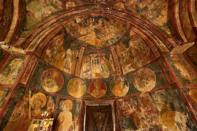 A frescoed church interior showing circular portraits and religious art, Byzantine Chapel of Agios Nikolaos Foundoukli, between Eleousa and Profitis Ilias, Rhodes, Dodecanese, Greek Islands, Greece, Europe