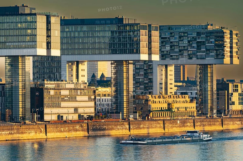 Crane houses in the Rheinau harbour, seen across the Rhine from the south bridge, Cologne, North Rhine-Westphalia, Germany, Europe