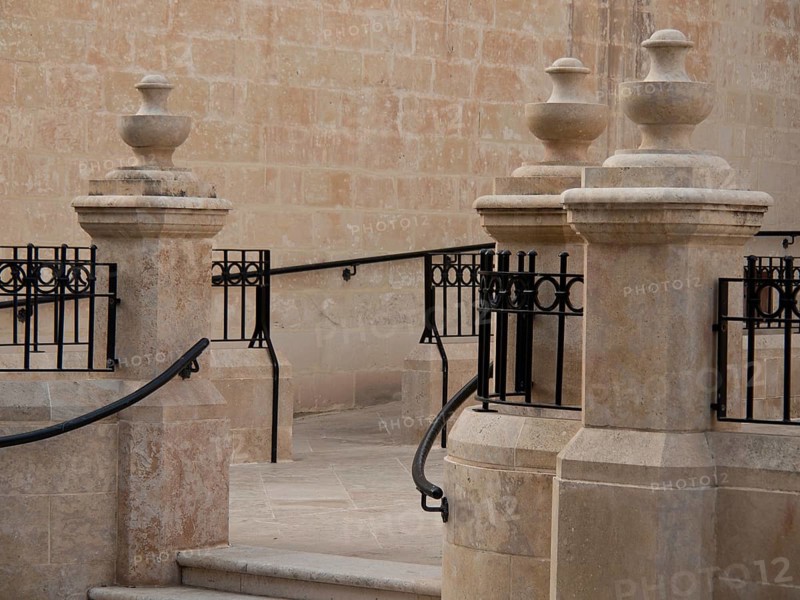 Close-up of a stone staircase with wrought-iron railing and wall, valetta, mediterranean sea, malta