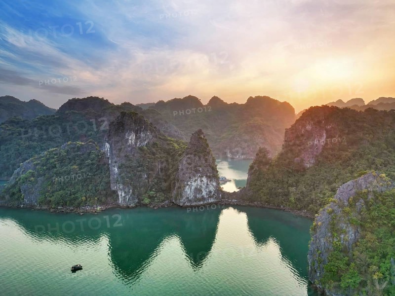 Ha Long Bay in Vietnam, a UNESCO World Heritage Site at sunset in an aerial view