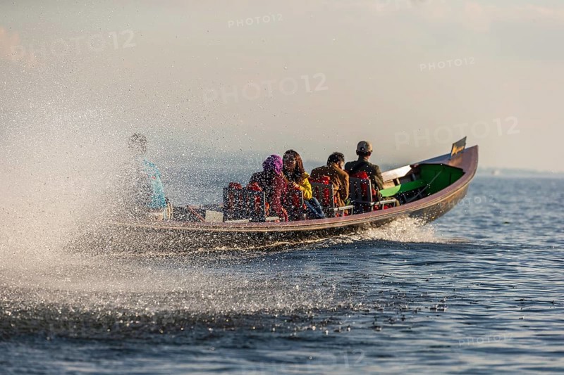 Water spitting canoe whizzing on water