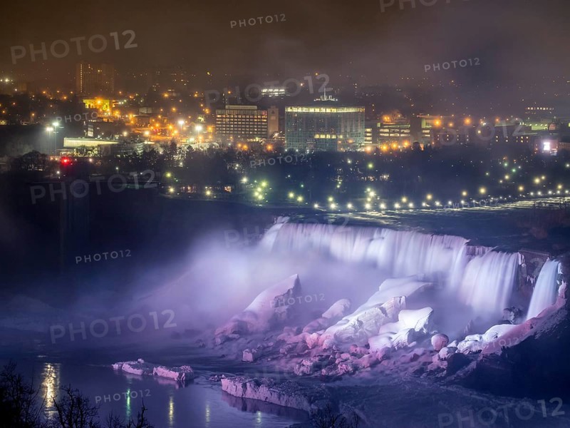 Niagara Falls lit at night seen from the Canadian side