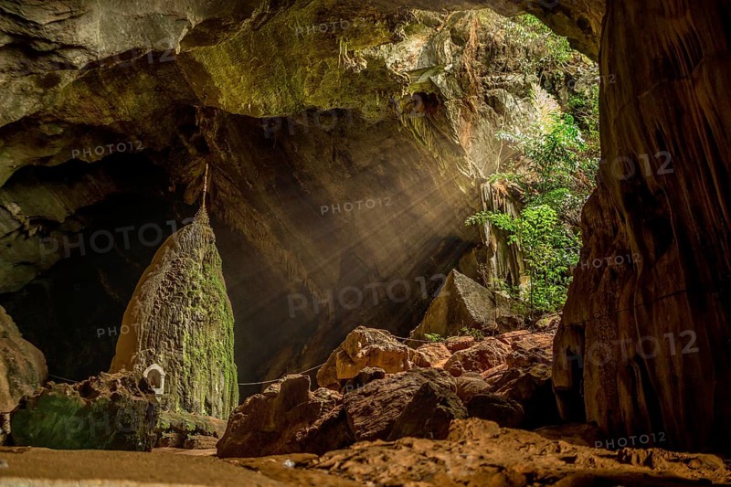 Sunrays illuminating sacred rock in the Kaw Goon cave