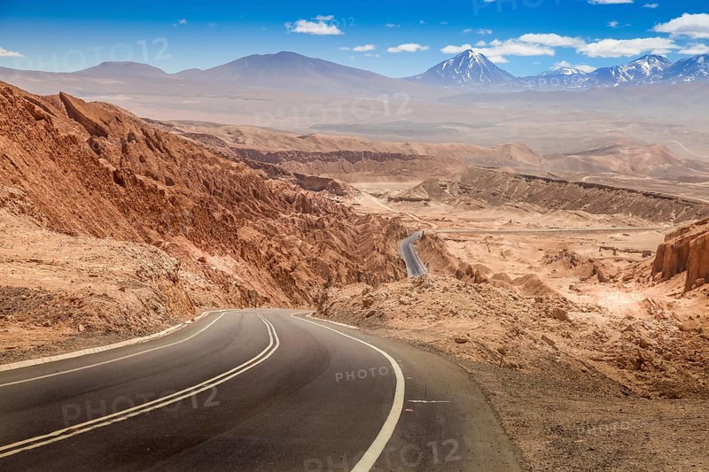 Road leading through the arid landscape at the Valley of the Moon in Chile