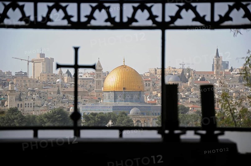 Cityspape of Jerusalem through a window of a church