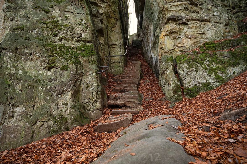 Devil Gorge at the Eifel, Teufelsschlucht with mighty boulders and canyon, hiking trail in Germany, sandstone rock formation, autumn