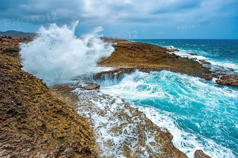 View of excursion destination in nature reserve Shete Boka National Park National Park from crevice Boka Pistol splashing high fountain of sea water with white spray, right moving sea strong wave, it whitecap swell of Caribbean Sea, Caribbean, Windward Islands, Netherlands Antilles, ABC Islands ABC Islands, Curaçao Curacao