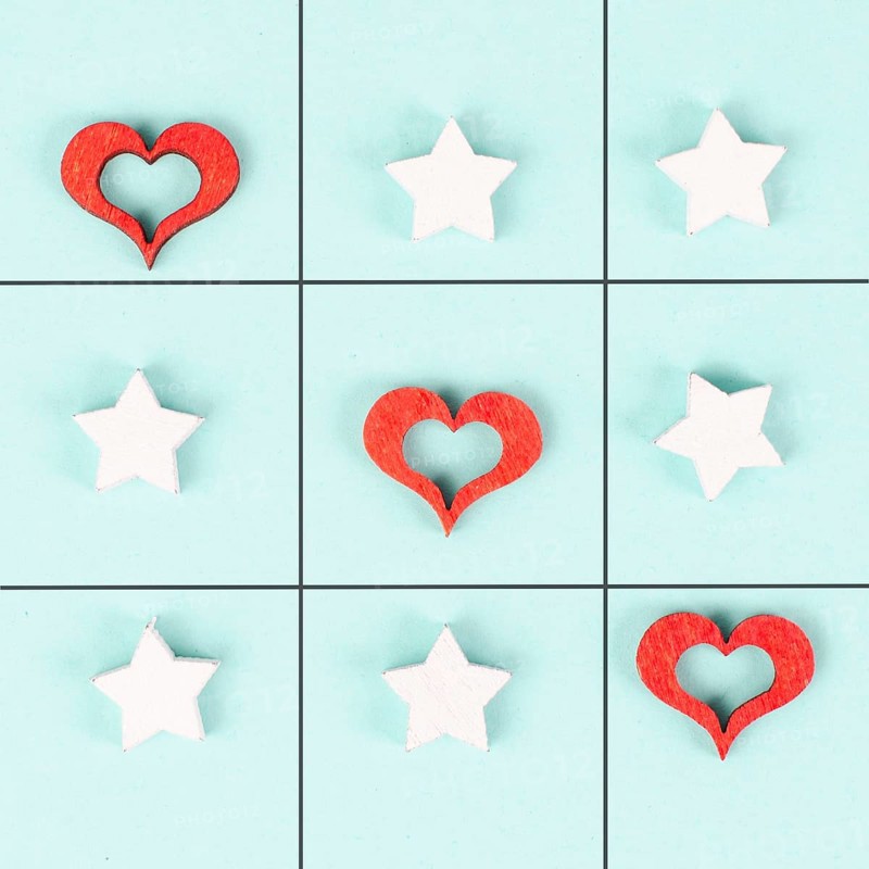 Tic tac toe game with red hearts and stars, symbol for love and emotion, valentines day