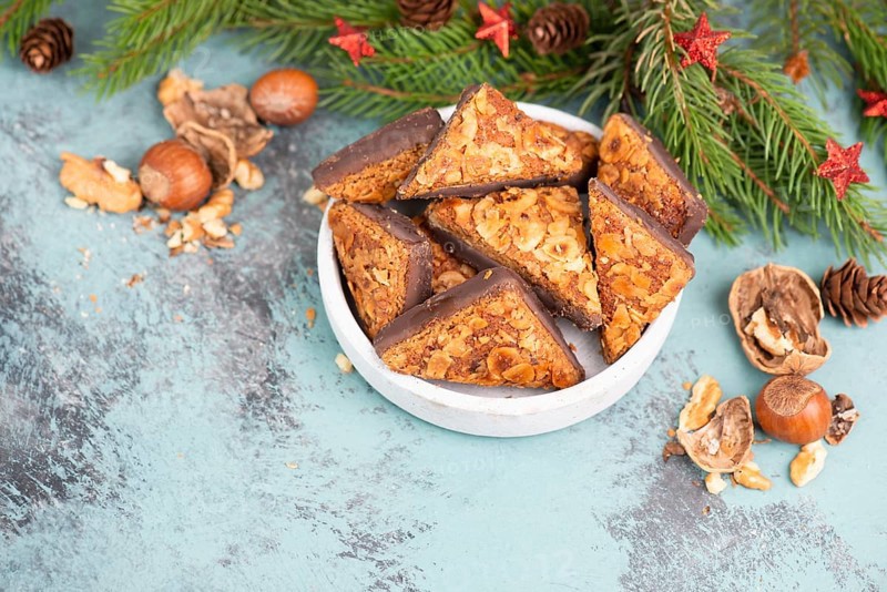Nut corner triangles, traditional german sweets called Nussecke, covered with chocolate, christmas cake