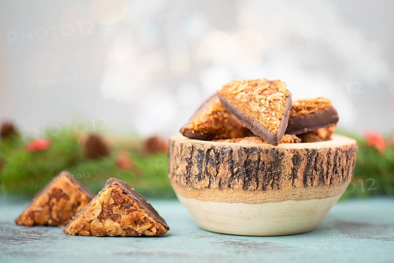 Nut corner triangles, traditional german sweets called Nussecke, covered with chocolate, christmas cake
