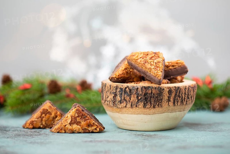 Nut corner triangles, traditional german sweets called Nussecke, covered with chocolate, christmas cake