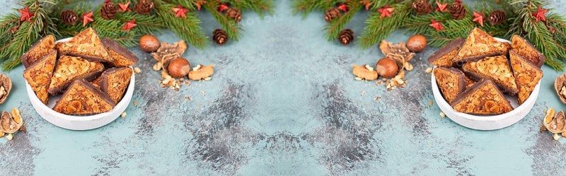 Nut corner triangles, traditional german sweets called Nussecke, covered with chocolate, christmas cake