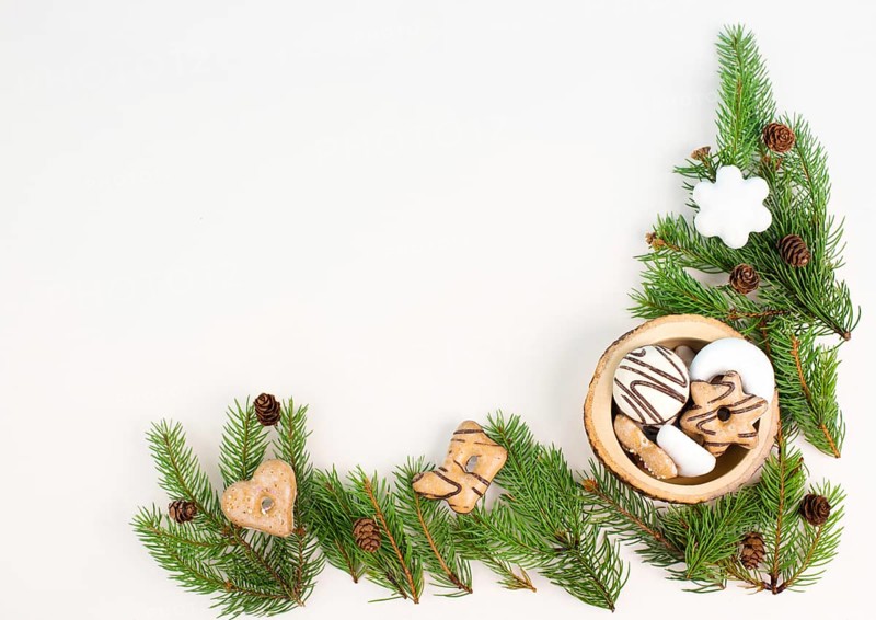 Nurnberg elisen gingerbread mix, traditional german christmas sweets with fir branches and pine cones, holiday background with copy space