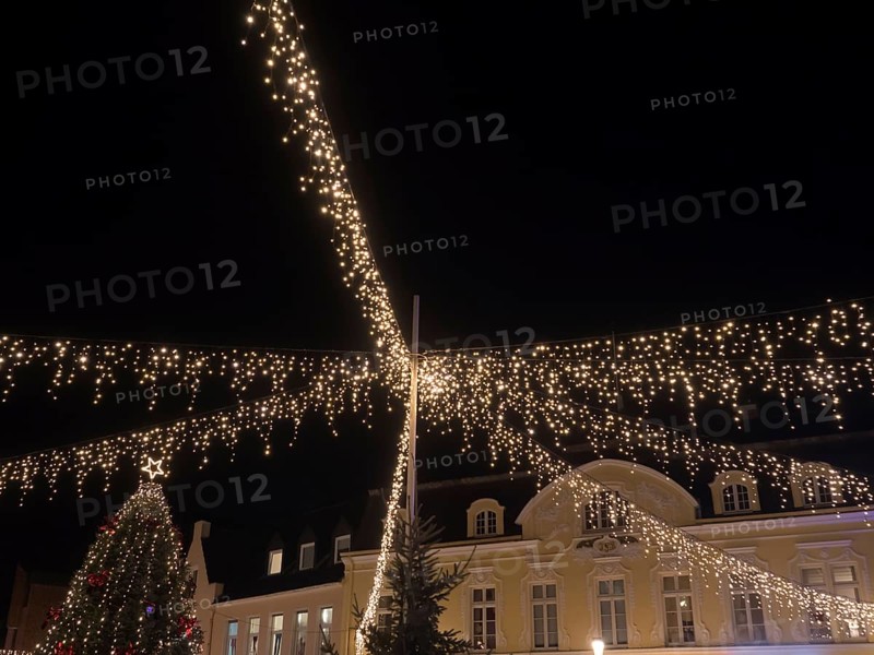 Fairy lights stretching across a square and festively illuminating a building, Ahaus, Münsterland, North Rhine-Westphalia, Germany, Europe