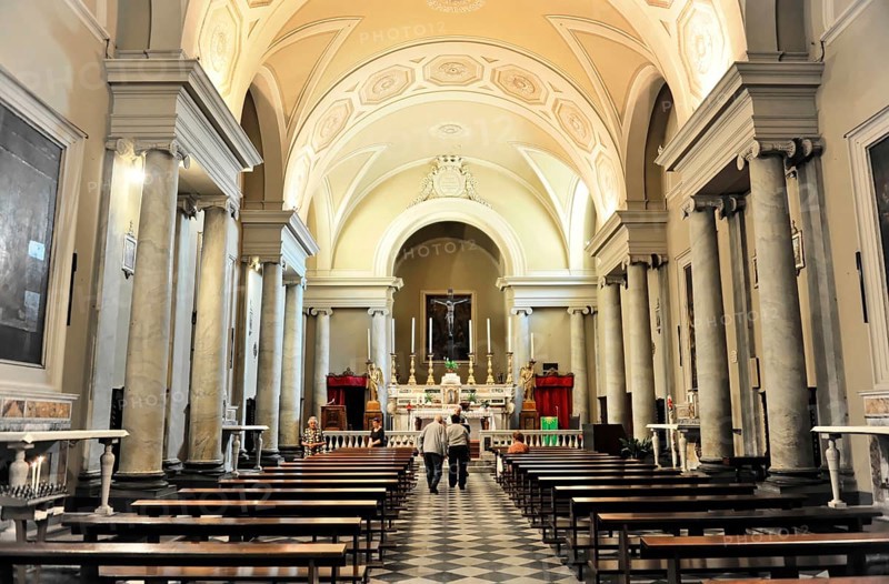 Chiesa di San Michele, interior view, start of construction 987, Volterra, Tuscany, Italy, Europe, Interior of a church with long wooden benches, an altar and large columns, Europe