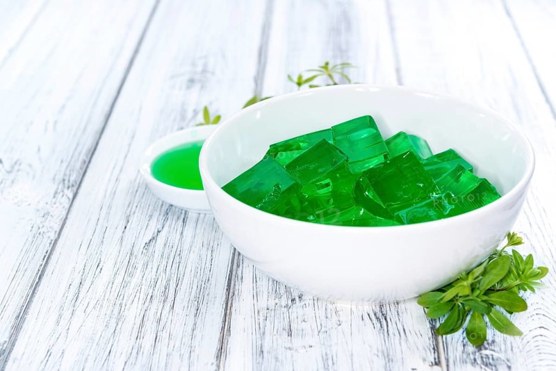 Fresh made Woodruff Jello (close-up shot) on wooden background