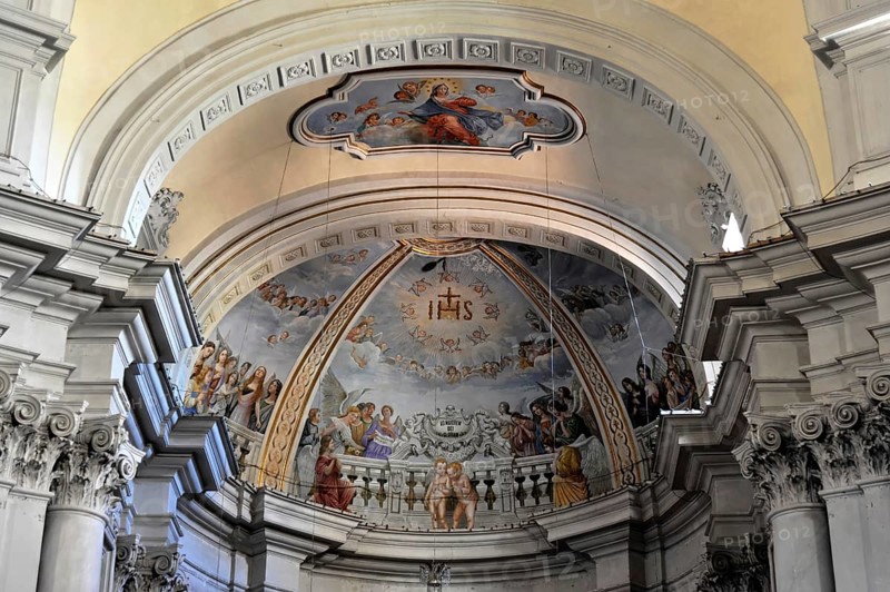 Montepulciano, Val d'Orcia, Province of Siena, Tuscany, Italy, Europe, An ornate ceiling fresco with divine scenes surrounded by white, ornately decorated beams, Tuscany, Europe Italy, Europe
