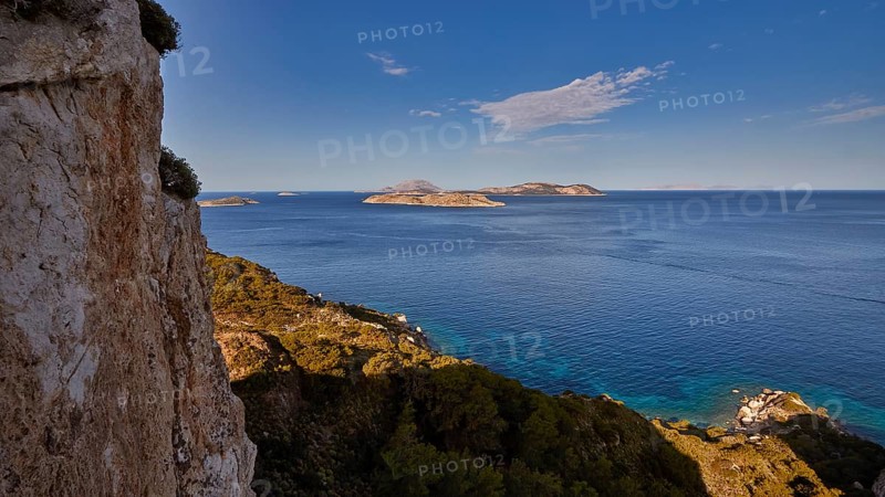 View from a cliff to the open sea and several islands in the distance under a blue sky, Makri Island, Alimia Island, Chalki Island, Kritinia Castle, St John's Castle, Kritinia, Rhodes, Dodecanese, Greek Islands, Greece, Europe