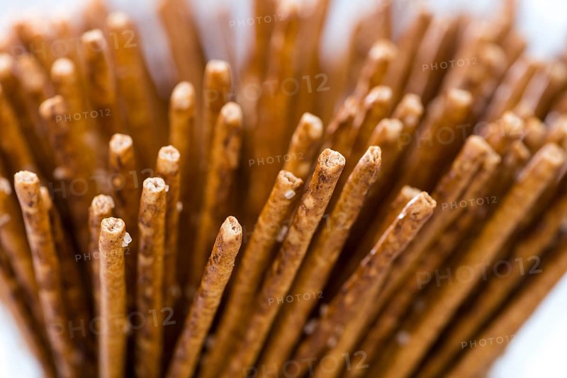 Salt Sticks (close-up shot) on bright wooden background