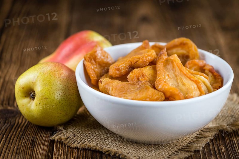 Some dried Pears (selective focus, close-up shot) on wooden background