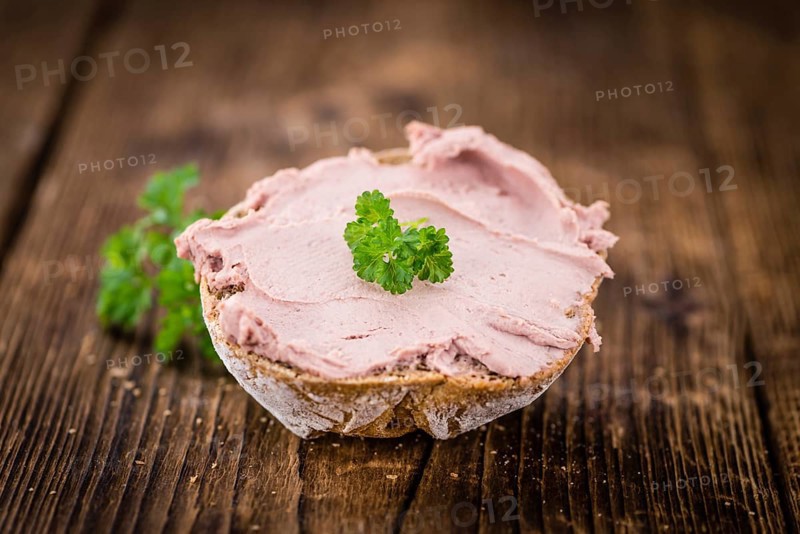 Liverwurst Sandwich on a vintage background as detailed close-up shot (selective focus)