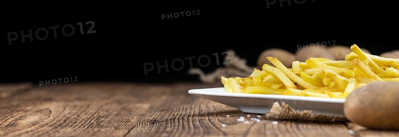 Portion of homemade French Fries (close-up shot, selective focus)