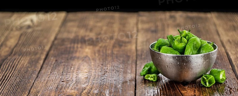 Raw Pimientos on a vintage background as detailed close-up shot, selective focus