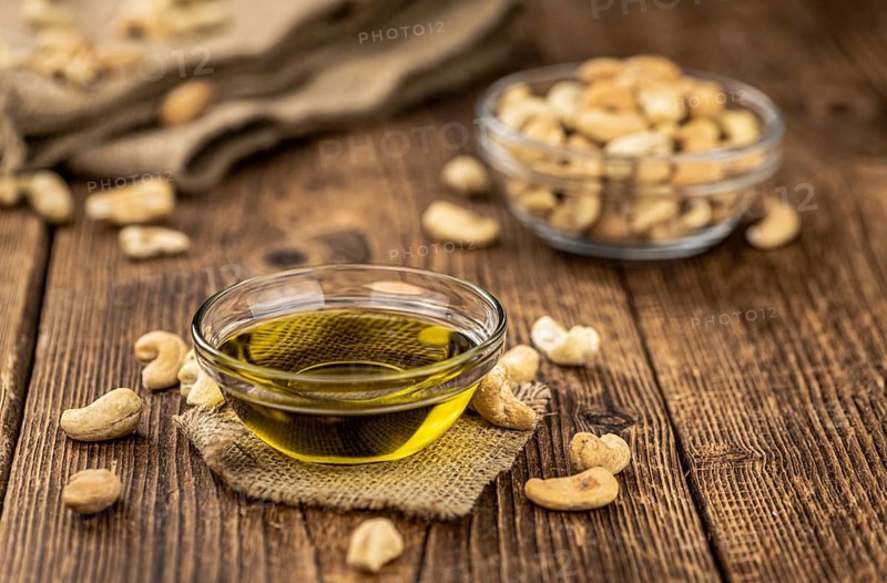 Portion of Cashew Oil (detailed close up shot, selective focus)