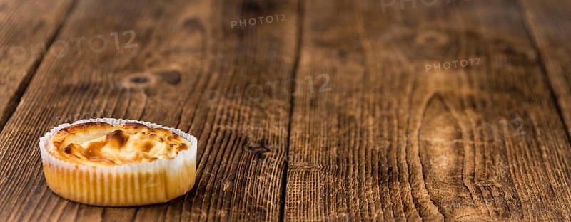 Homemade Cheesecake on vintage background (selective focus, close-up shot)
