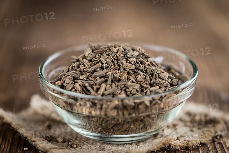 Valerian Roots on a wooden table (detailed close-up shot)