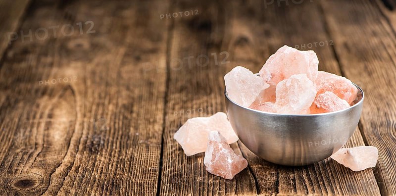 Portion of pink himalayan Salt (detailed close-up shot, selective focus)