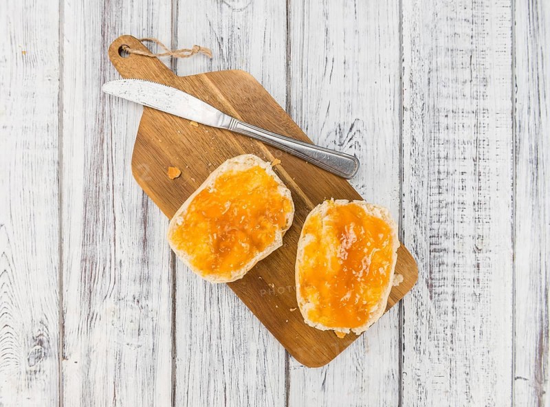 Peach Jam on a vintage background as detailed close-up shot, selective focus