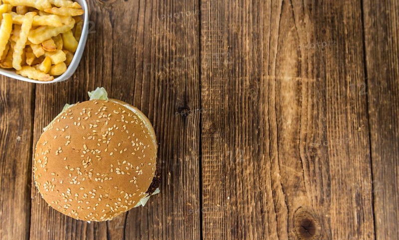 Wooden table with a homemade Falafel Burger (selective focus)