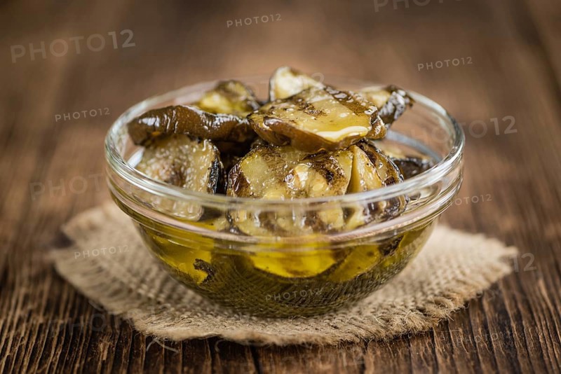 Homemade Antipasti (Grilled Zucchinis) on vintage background (selective focus, close-up shot)