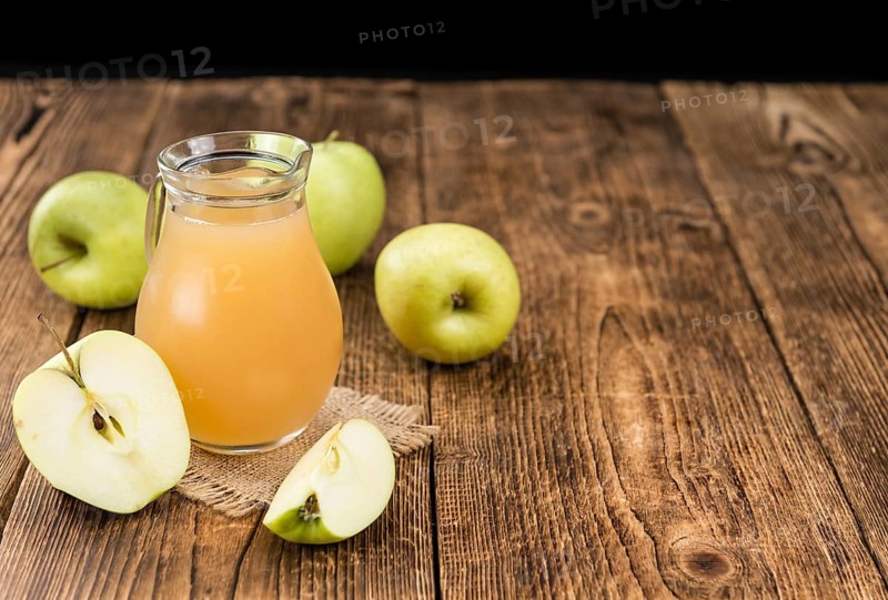 Fresh made Juice (apple) on a vintage background (close-up shot)