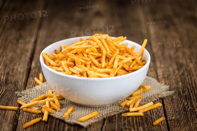Portion of fried potato sticks (close-up shot, selective focus)