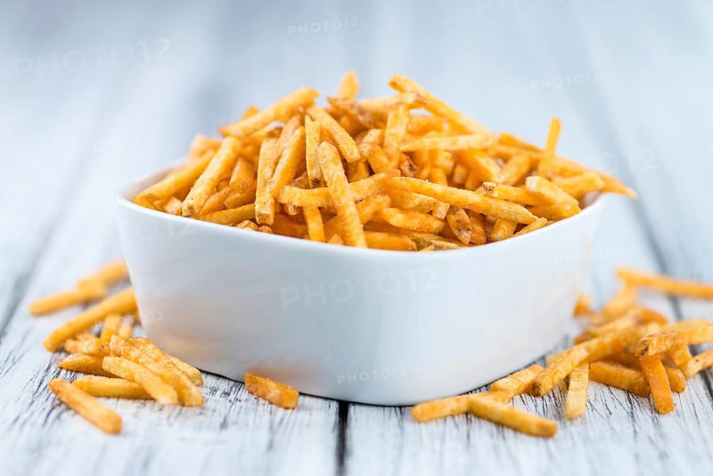 Portion of fried potato sticks (close-up shot, selective focus)