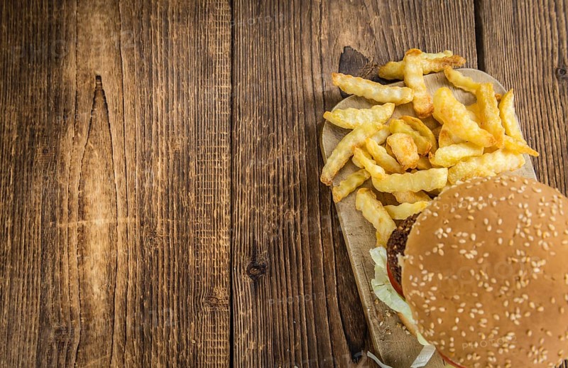 Wooden table with a homemade Falafel Burger (selective focus)