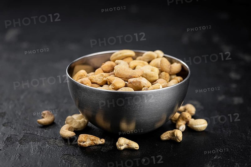 Portion of Cashew Nuts (close up shot, selective focus)