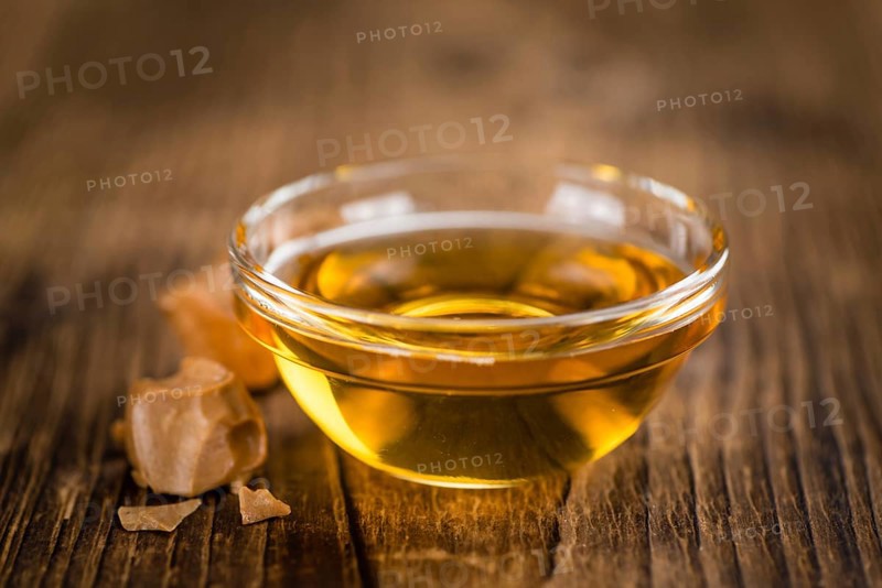 Portion of fresh Caramel Sirup (close-up shot, selective focus)