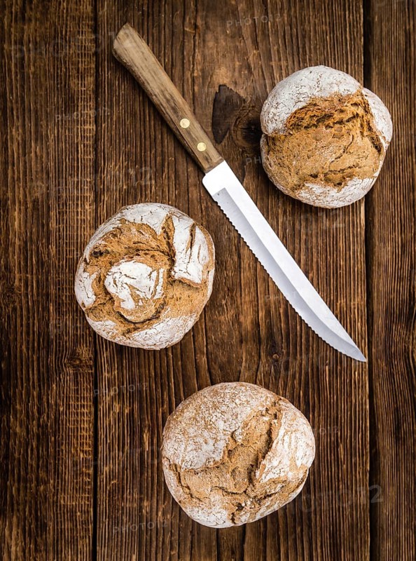 Wholemeal Roll on a vintage background as detailed close-up shot (selective focus)