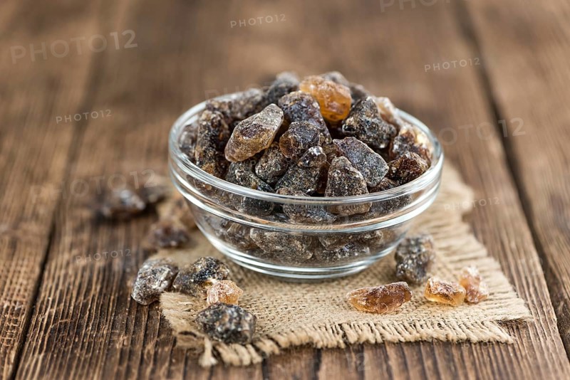 Portion of brown Rock Candy as detailed close-up shot (selective focus)