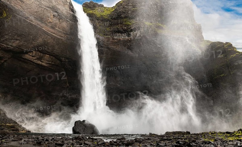 Haifoss waterfall in western Iceland at a cloudy summer day