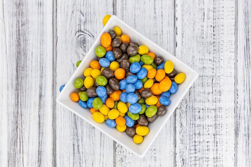 Chocolate coated peanuts as detailed close up shot (selective focus)