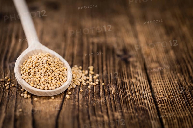 Portion of fresh made Mustard Seeds (close-up shot, selective focus)