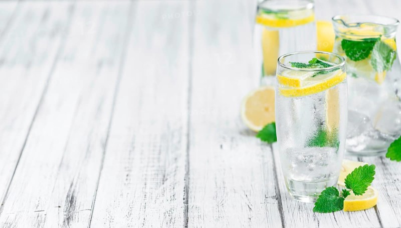 Lemonade on a vintage background as detailed close-up shot (selective focus)